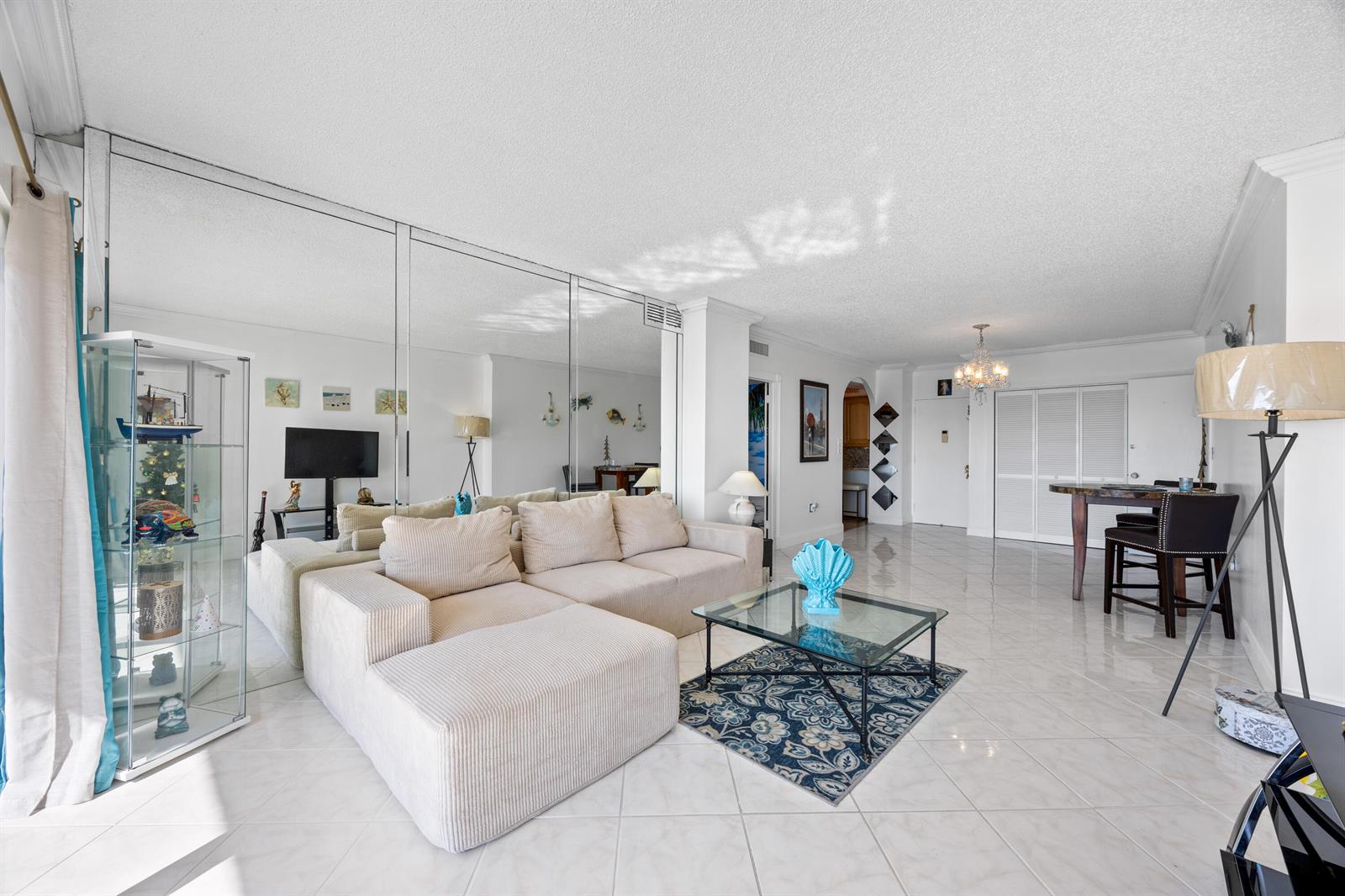 An elevated view shows a coastal city with high-rise buildings, a road, and the ocean — 1985 S Ocean Drive, Hallandale Beach FL 33009, HALLANDALE BEACH, FL