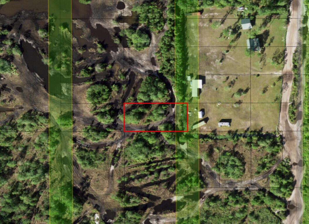 This aerial map shows a wooded lot with a red rectangle highlighting a specific area — 0 Holopaw Groves Road, FL 34772, FL