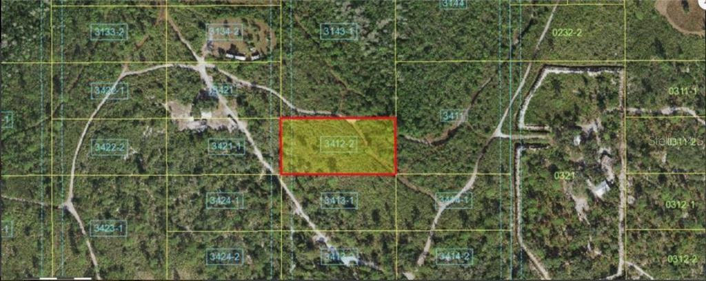 This is an aerial map showing a highlighted rectangular plot of land among wooded terrain — HOLOPAW GROVES ROAD, ST CLOUD, FL
