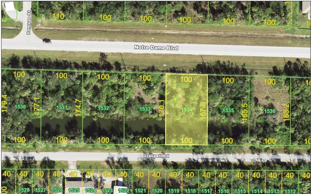 This is a map showing a highlighted rectangular land parcel located between two roads — 26201 NOTRE DAME BLVD, PUNTA GORDA, FL