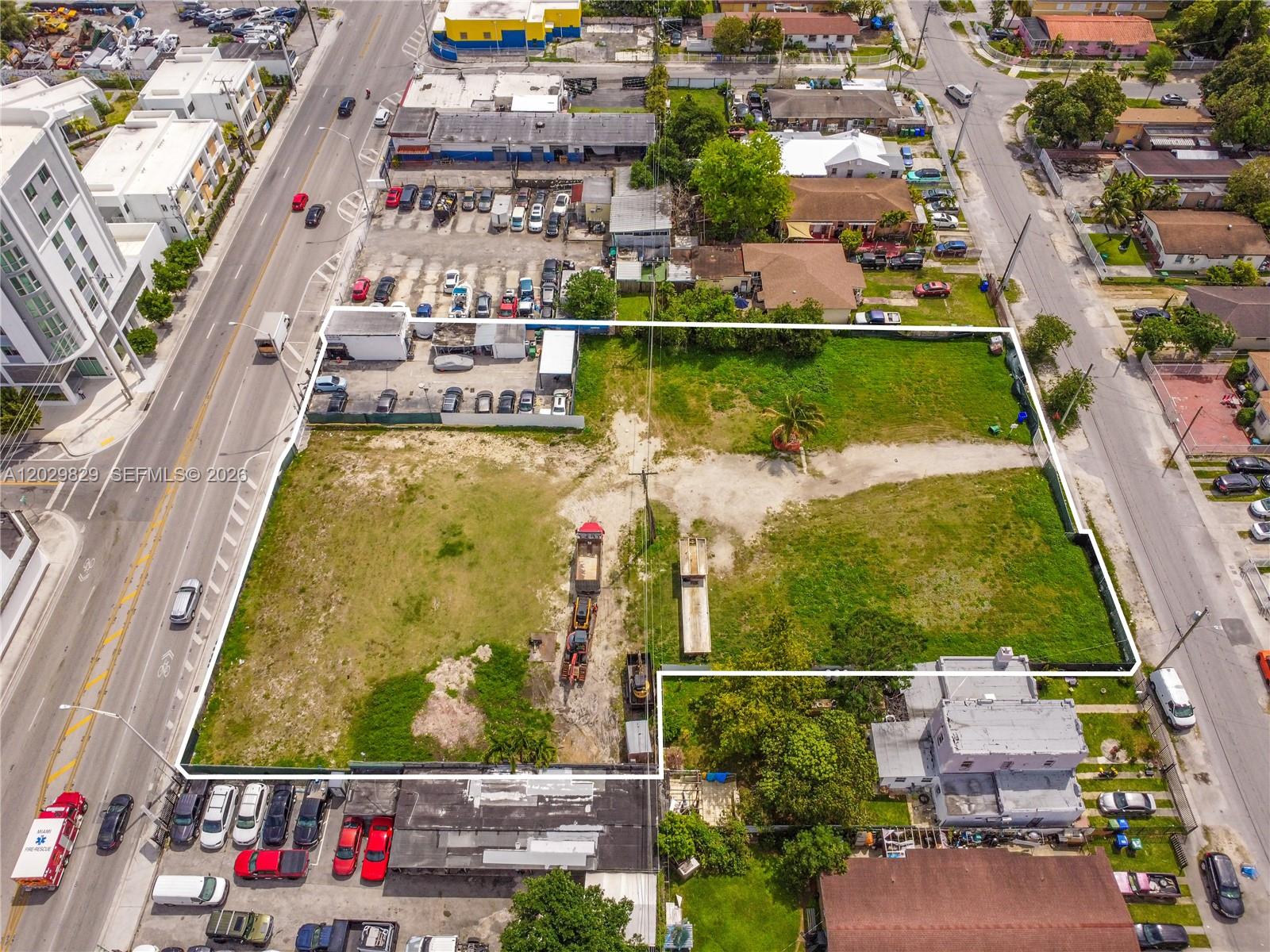 An aerial view shows a large, rectangular vacant lot enclosed by a white property line — 2140 NW 36th St, Miami FL 33142, MIAMI, FL