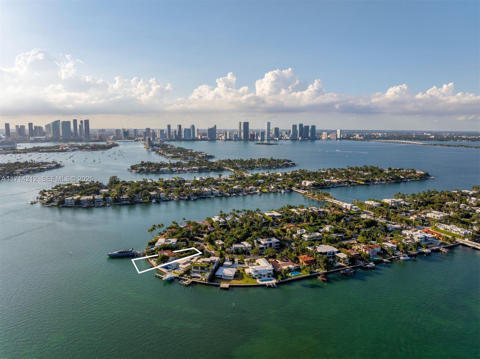 An aerial view shows a waterfront property outlined in white on a residential island — 11 E Rivo Alto Dr, Miami Beach FL 33139, MIAMI BEACH, FL