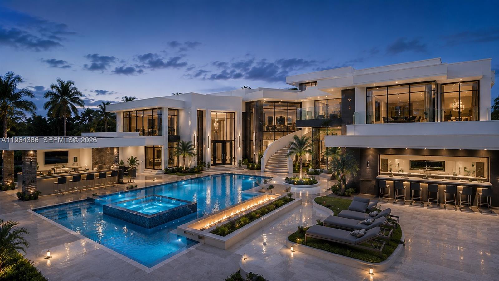 A modern luxury mansion features a large swimming pool, outdoor bar, and curved staircase at dusk — 14799 SW 48th Ct, Miramar FL 33027, MIRAMAR, FL