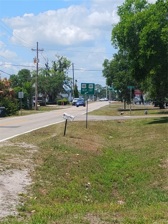 A road sign indicates the next exit for US Highways 441 and 301 — 2507 N MAGNOLIA AVENUE, OCALA, FL