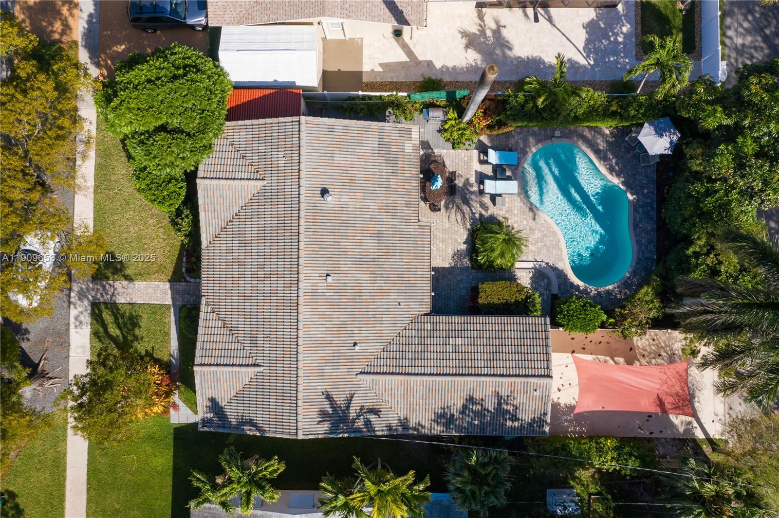 An aerial view shows a house with a tiled roof, a swimming pool, and landscaping — 418 SE 3rd Ter # 0, Dania Beach FL 33004, DANIA BEACH, FL
