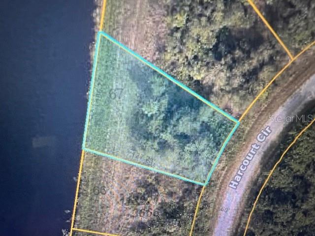 This is an aerial map view of a vacant, waterfront residential lot — LOT 67 HARCOURT CIRCLE, NORTH PORT, FL