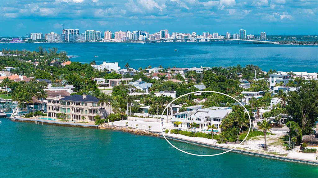 An aerial view of a waterfront house with a white exterior and a flat roof — 1209 WESTWAY DRIVE, SARASOTA, FL