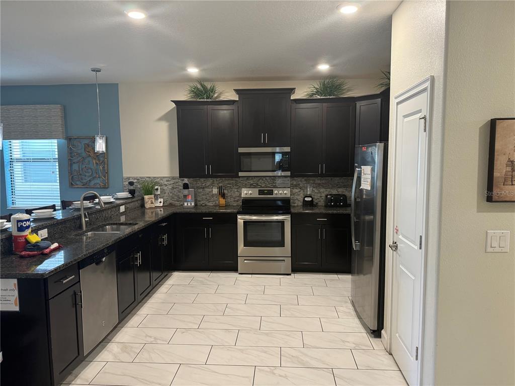 9158 SCRAMBLE DRIVE, DAVENPORT, FL — photo 5 of 28