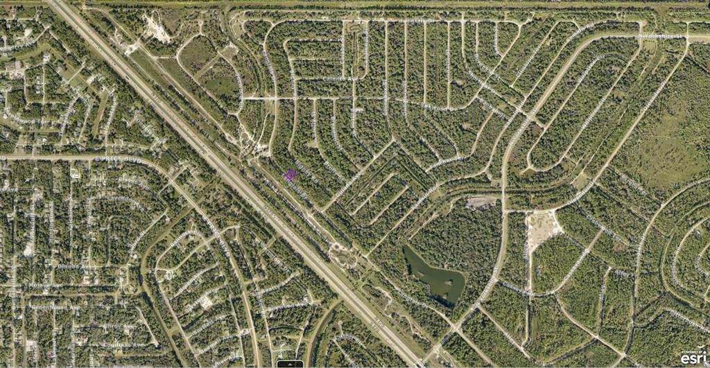 This is an aerial map view of a residential neighborhood with wooded lots and roads — 1124232509 LANGLAIS DRIVE, NORTH PORT, FL