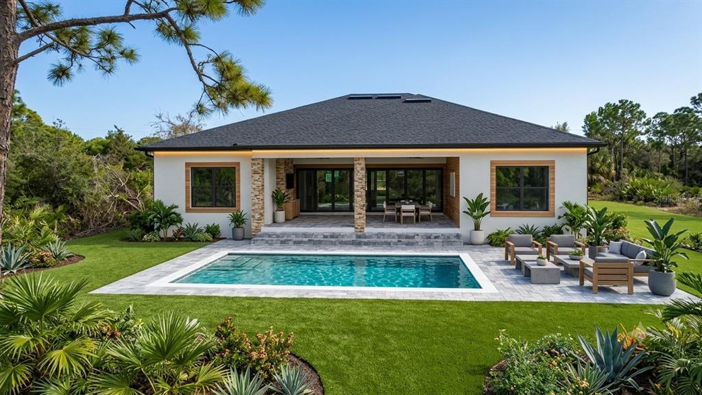 A single-story house with a backyard pool, patio, and landscaped lawn under a clear sky — 7731 PINEDALE DRIVE, PORT CHARLOTTE, FL