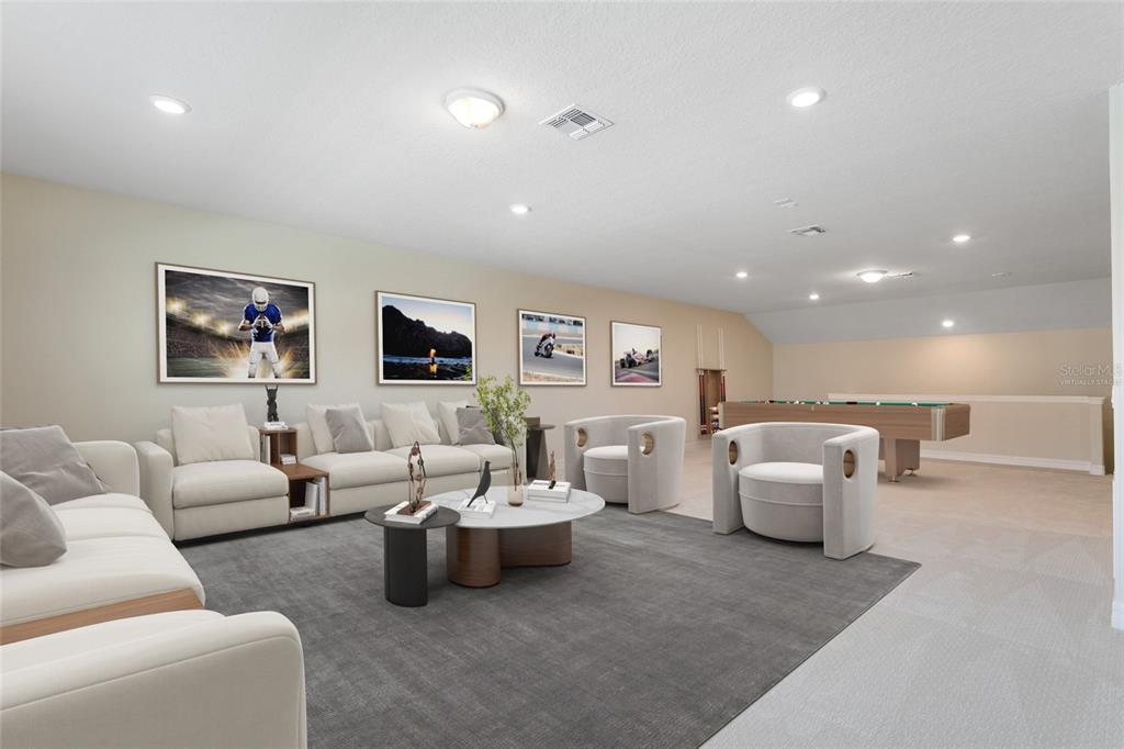 A spacious, virtually staged game room features a large sectional sofa, armchairs, and a pool table — 9212 HANGING VINE COURT, ORLANDO, FL