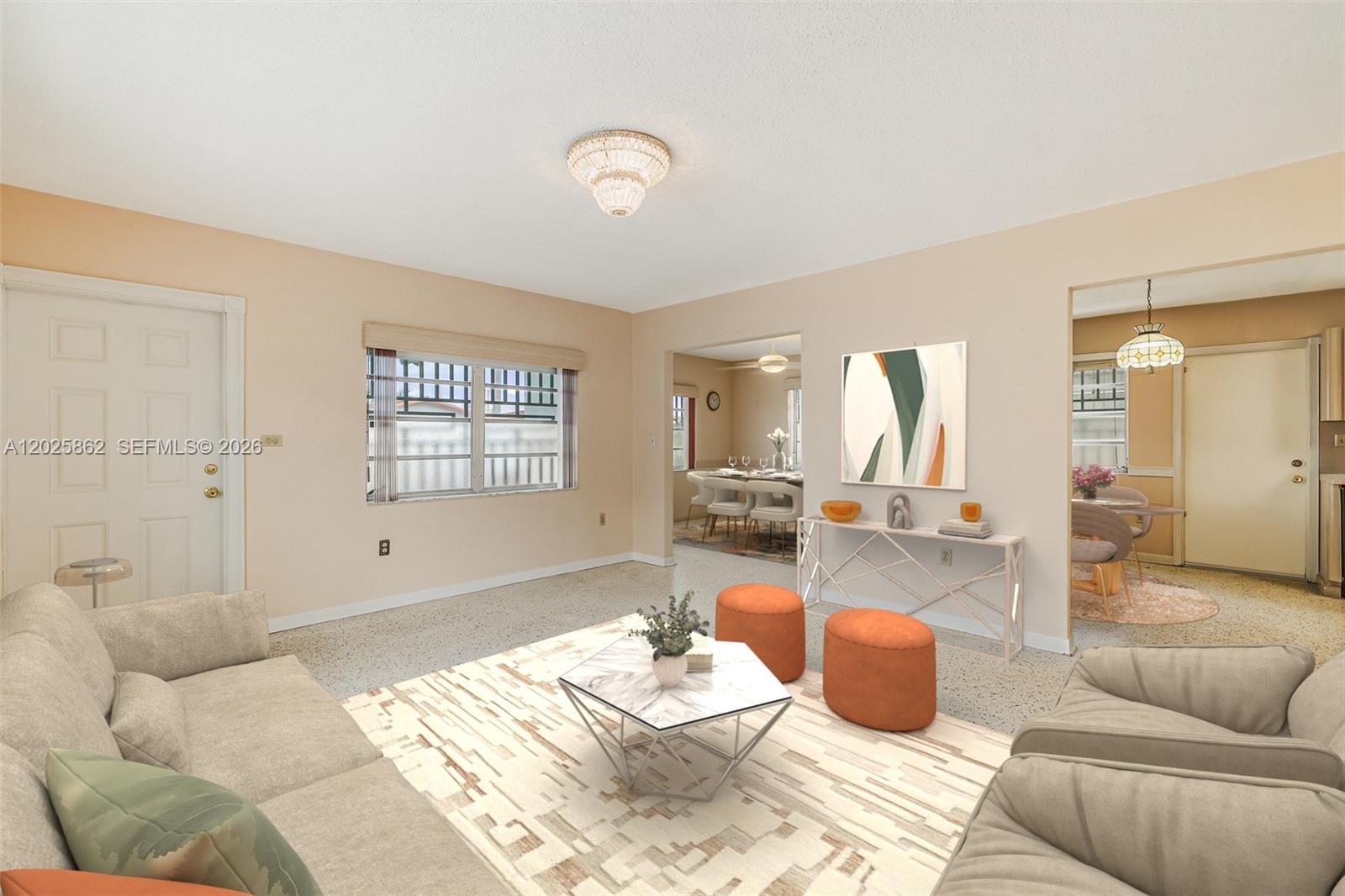 A living room with beige walls, a white rug, and two orange ottomans — 251 NW 60th Ct, Miami FL 33126, MIAMI, FL