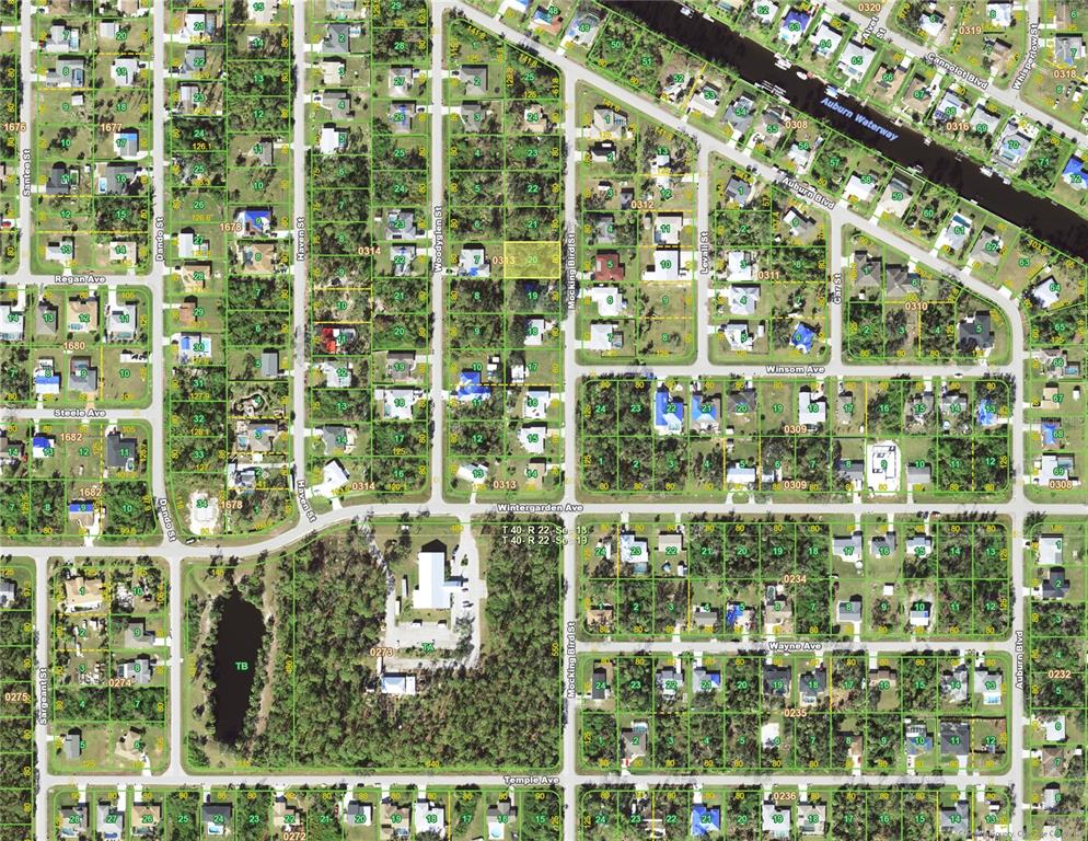 This is an aerial map showing residential lots and streets in a suburban neighborhood — 2473 MOCKINGBIRD STREET, PORT CHARLOTTE, FL