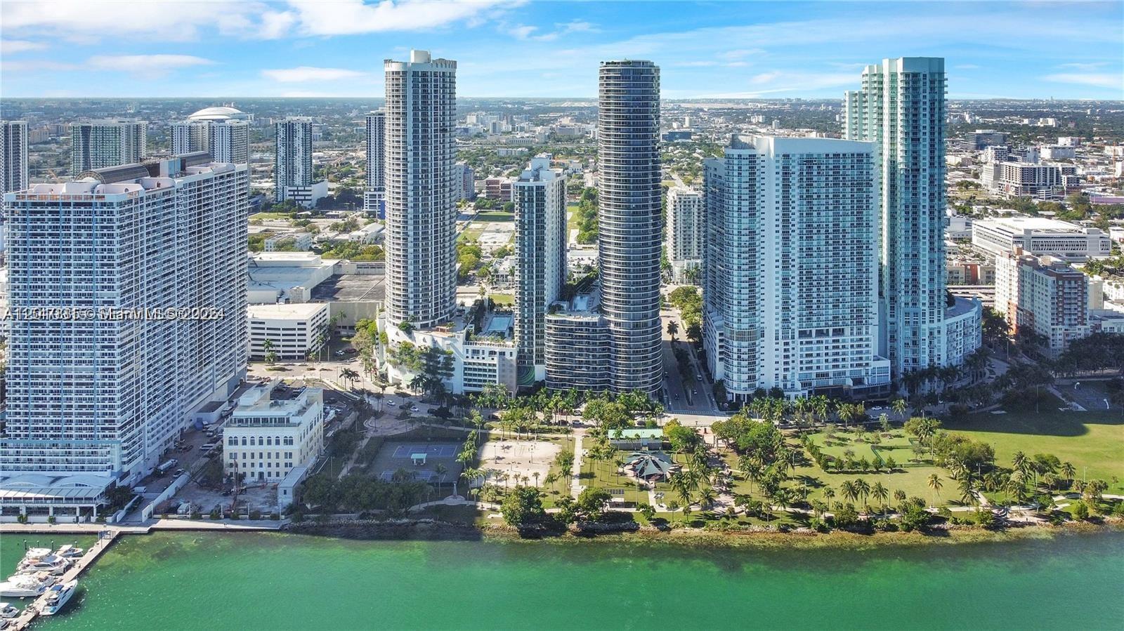 An aerial view of high-rise apartment buildings located along a waterfront park in Miami — 488 NE 18th St # 301, Miami FL 33132, MIAMI, FL