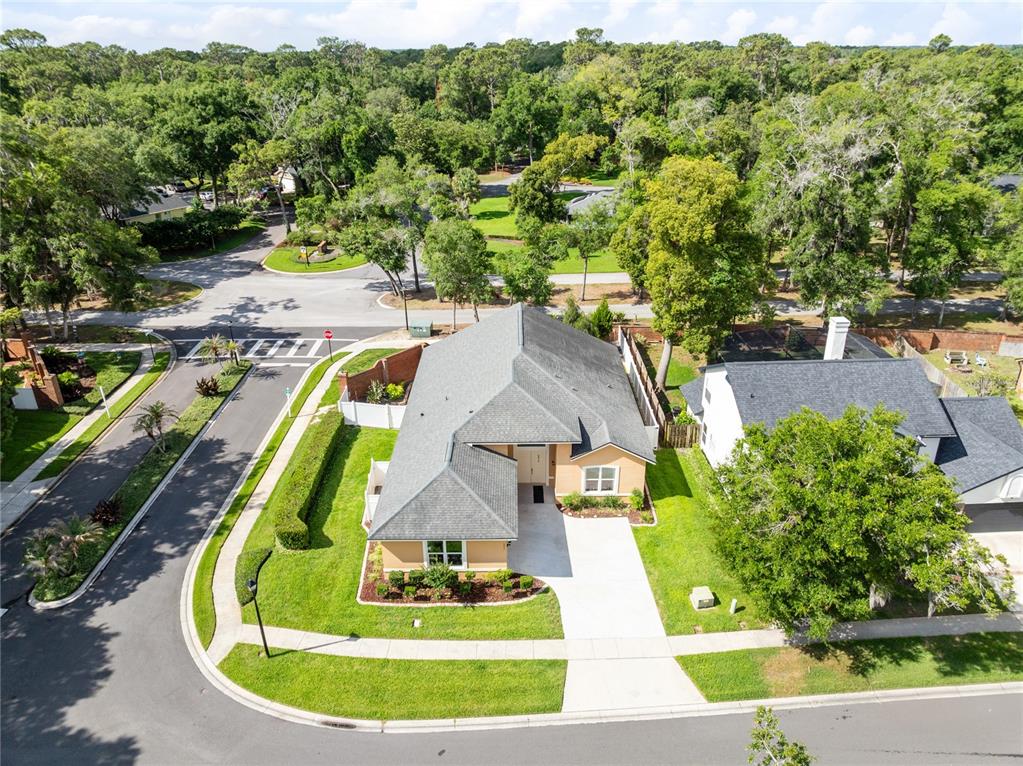 An aerial view of a single-story house with a gray roof and concrete driveway — 683 OAK HOLLOW WAY, ALTAMONTE SPRINGS, FL