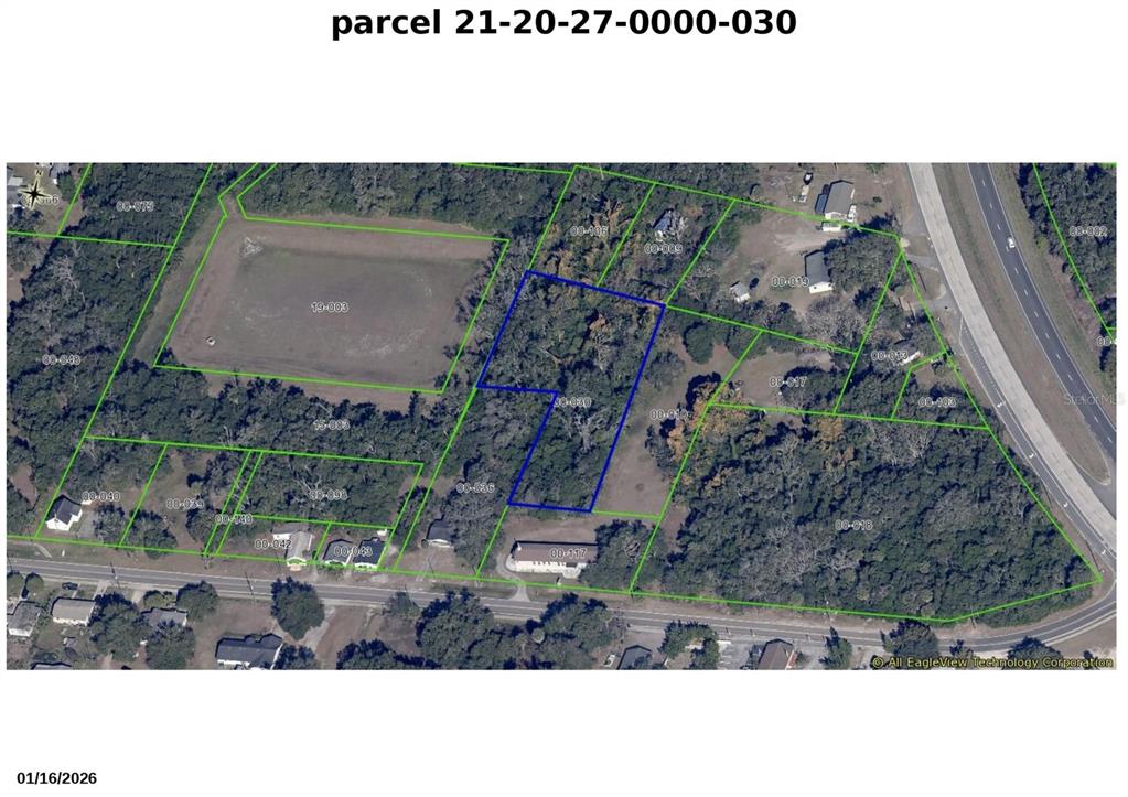 This is an aerial map showing a highlighted land parcel with surrounding properties and vegetation — 3752 N ORANGE BLOSSOM TRAIL, MOUNT DORA, FL