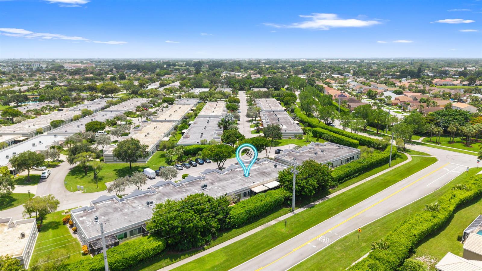 An aerial view shows a flat-roofed commercial building complex surrounded by trees and roads — 9305 Flynn Circle # 6, Boca Raton FL 33496, BOCA RATON, FL
