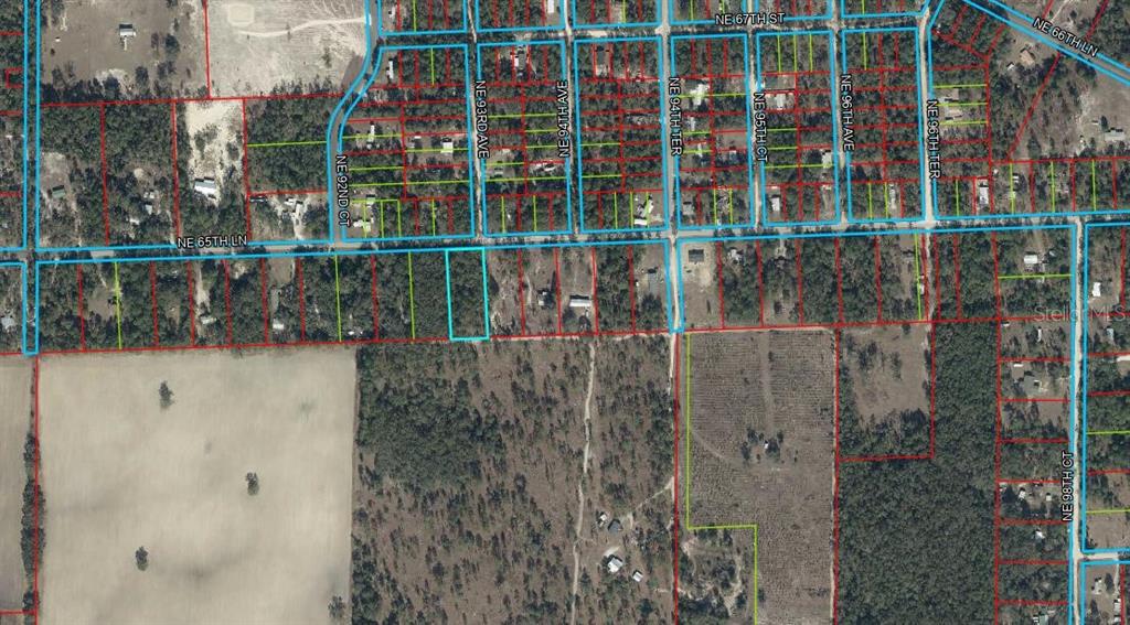 This is an aerial map showing property boundaries and road layouts in a rural area — TBD NE 65TH LANE, BRONSON, FL