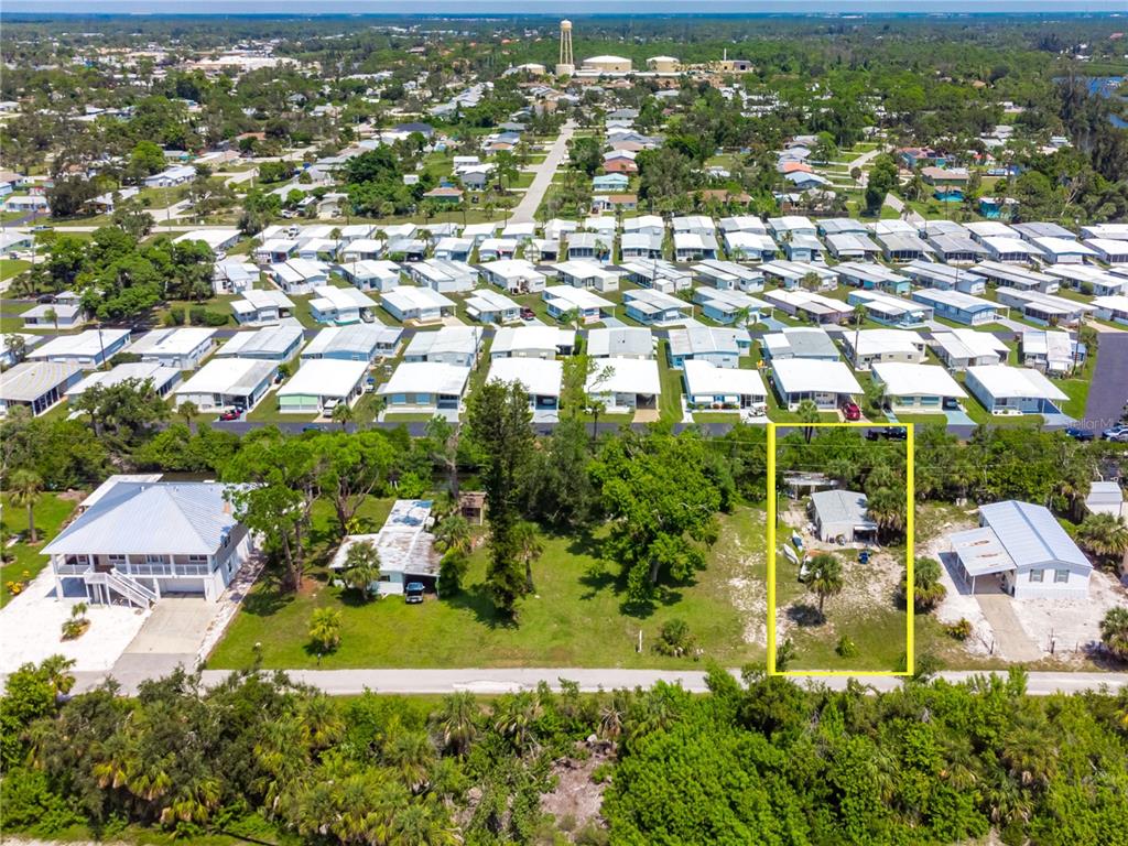 An aerial view shows a small house highlighted in yellow within a residential neighborhood — 240 RIVERVIEW AVENUE, ENGLEWOOD, FL