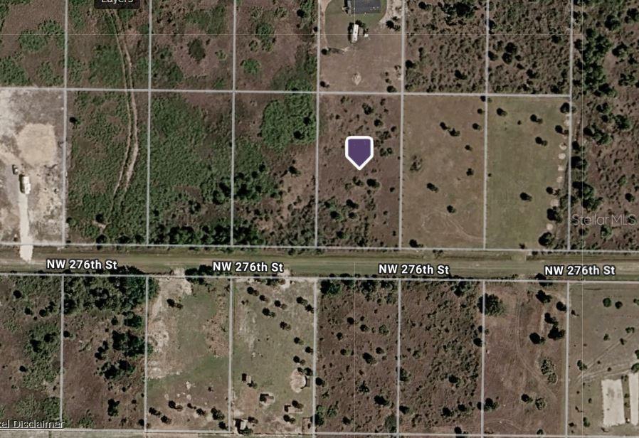 This is an aerial map view of a vacant, rectangular plot of land — 21117 NW 276TH STREET, OKEECHOBEE, FL