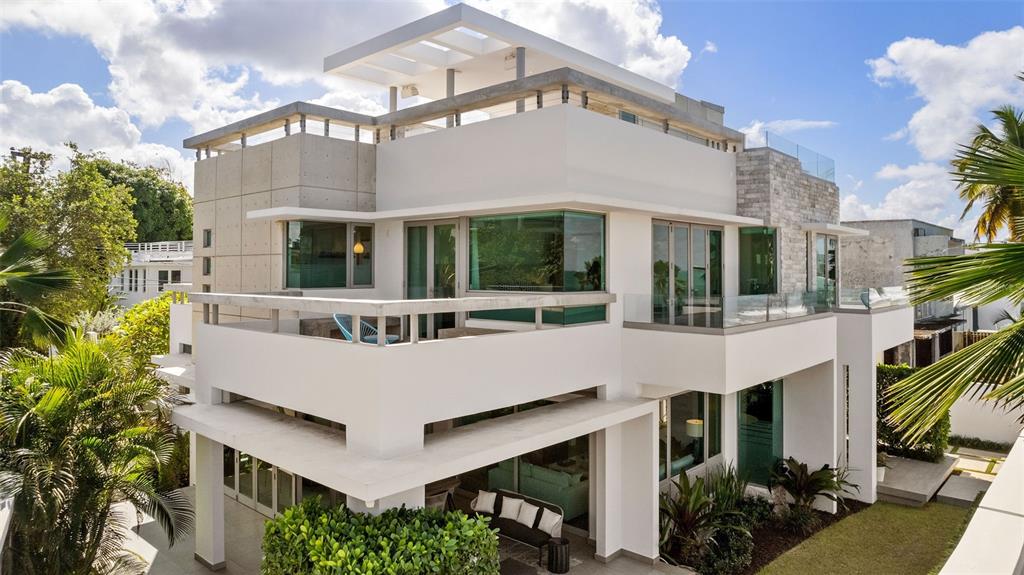 A modern multi-story house with white stucco, concrete accents, glass railings, and a rooftop terrace — 2220 PARK BOULEVARD, SAN JUAN, PR