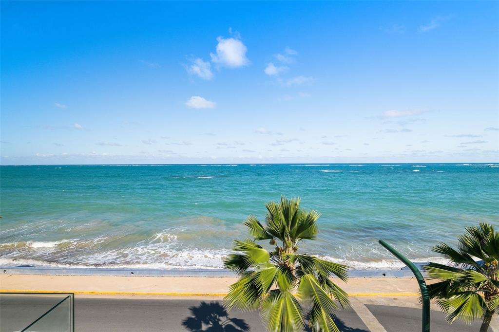 A view of the ocean and a coastal road from an elevated vantage point — 2220 PARK BOULEVARD, SAN JUAN, PR
