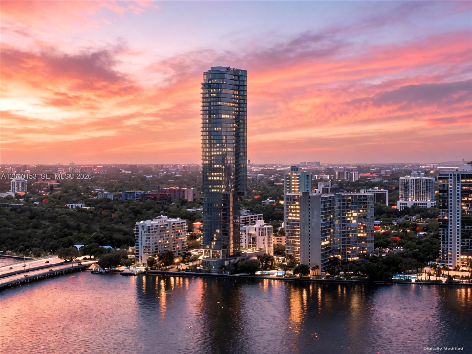 This is a digital rendering of a tall glass skyscraper overlooking a body of water — 175 SE 25th., Miami FL 33129, MIAMI, FL