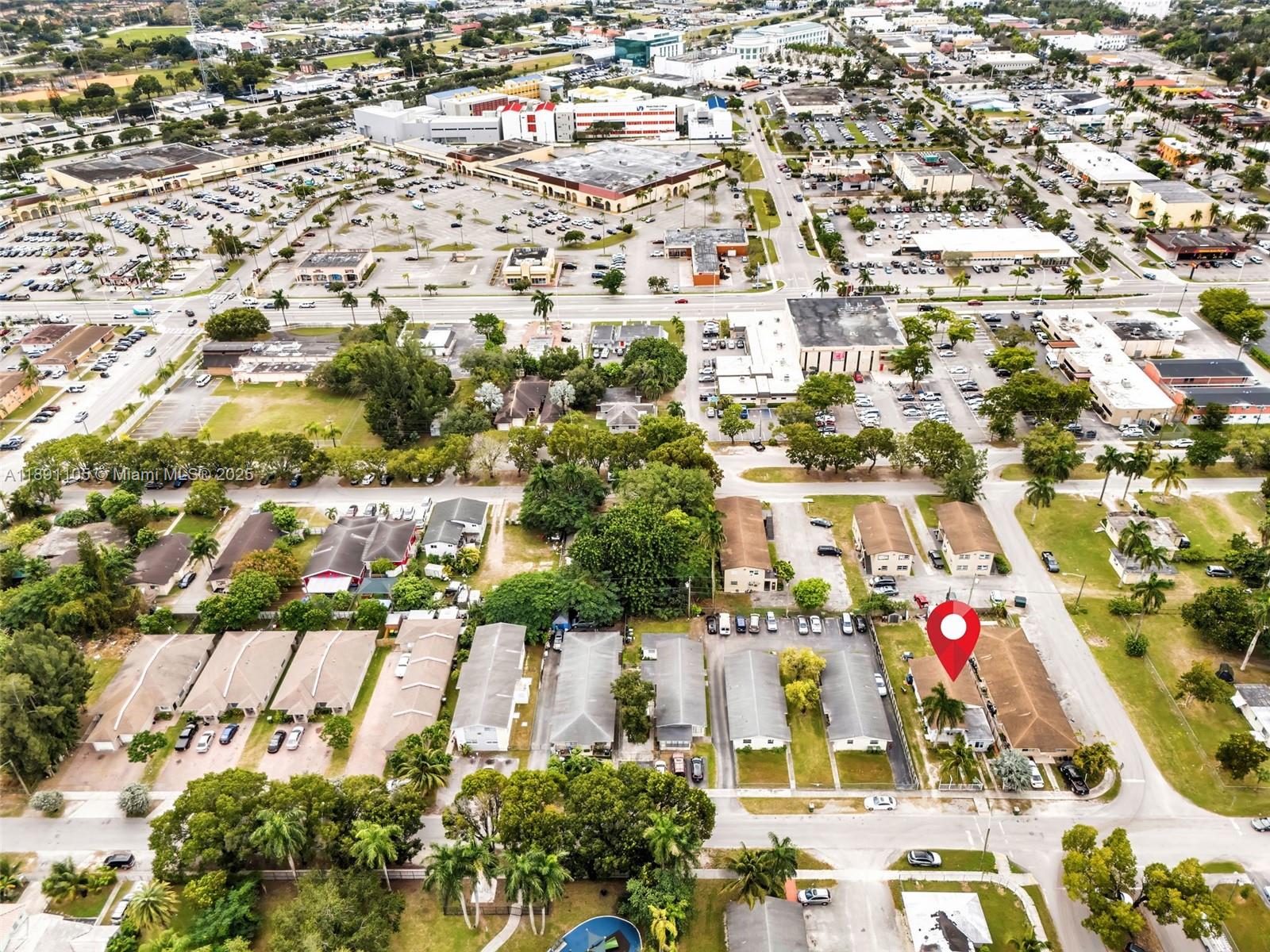 An aerial view shows a residential neighborhood with several single-story apartment buildings and parking lots — 110 NE 9th Ct, Homestead FL 33030, HOMESTEAD, FL