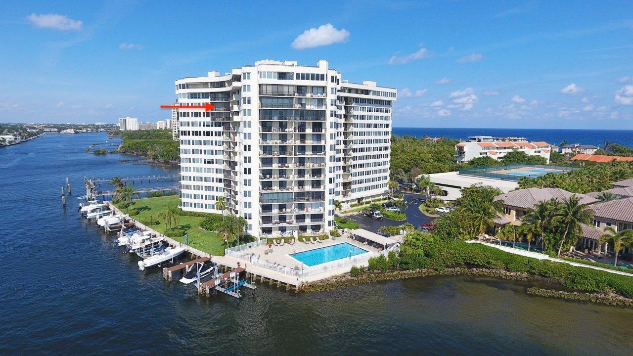 An aerial view of a waterfront high-rise condominium building with a pool and boat docks — 3912 S Ocean Boulevard # 1211, Highland Beach FL 33487, HIGHLAND BEACH, FL