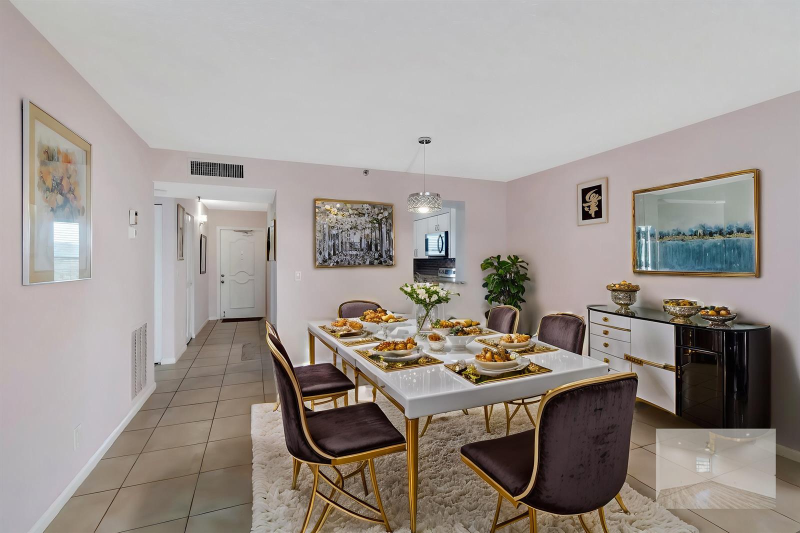A dining room features a white table, dark velvet chairs, and a white sideboard — 14623 Bonaire Boulevard # 502, Delray Beach FL 33446, DELRAY BEACH, FL