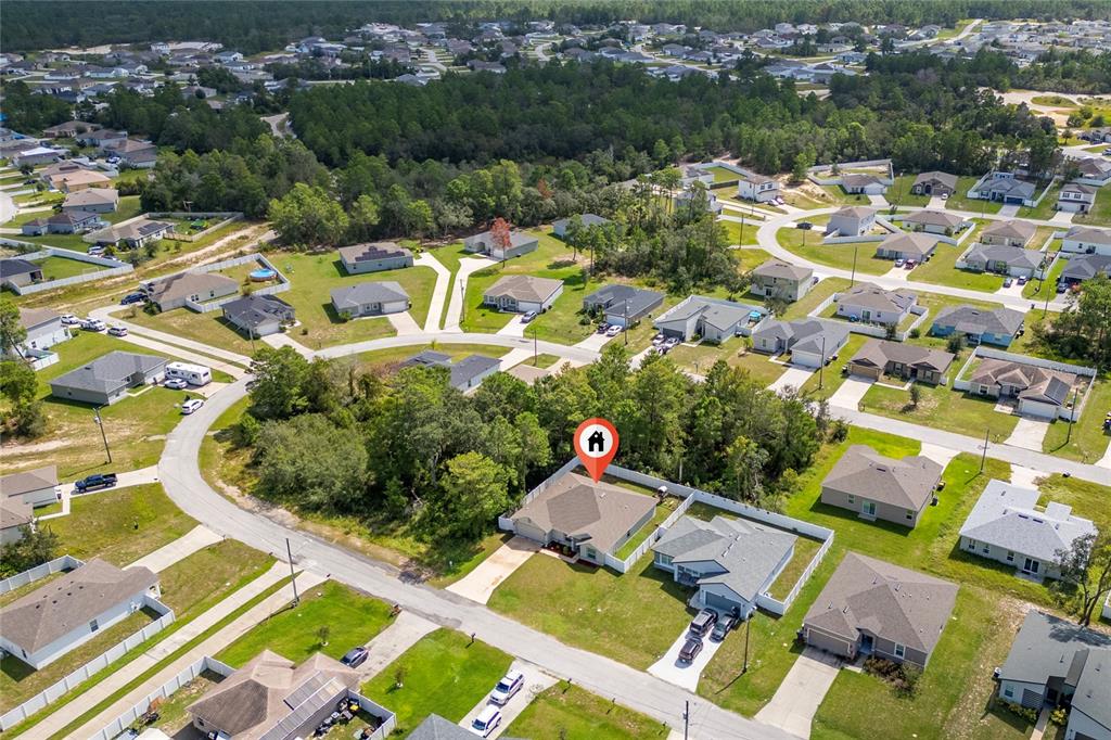 An aerial view shows a suburban neighborhood with a house marked by a location pin — 236 ELM COURT, KISSIMMEE, FL