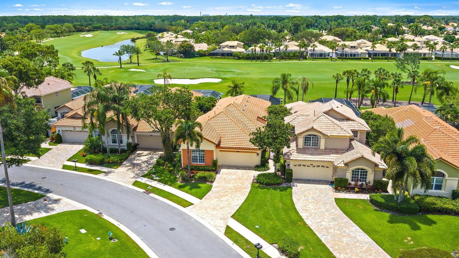 An aerial view of several suburban houses with tile roofs overlooking a golf course — 10350 Osprey Trace, West Palm Beach FL 33412, WEST PALM BEACH, FL