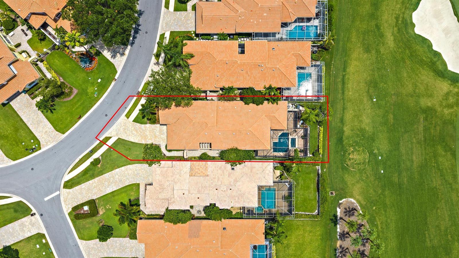 An aerial view shows a house with a tiled roof, pool, and driveway on a golf course — 10350 Osprey Trace, West Palm Beach FL 33412, WEST PALM BEACH, FL