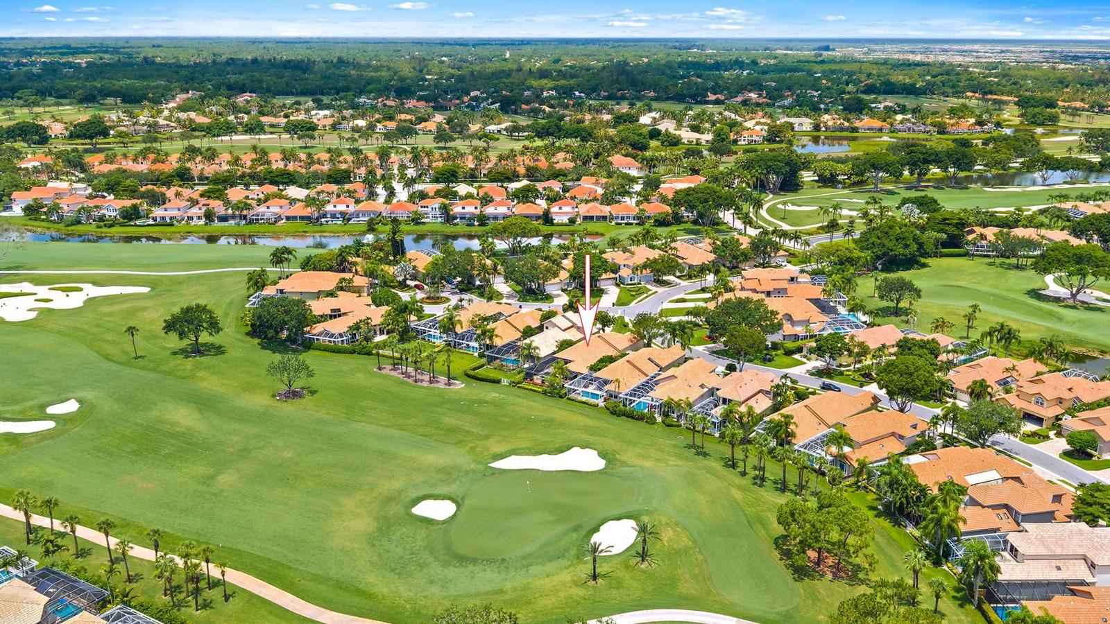 An aerial view shows a residential neighborhood with houses situated along a golf course — 10350 Osprey Trace, West Palm Beach FL 33412, WEST PALM BEACH, FL