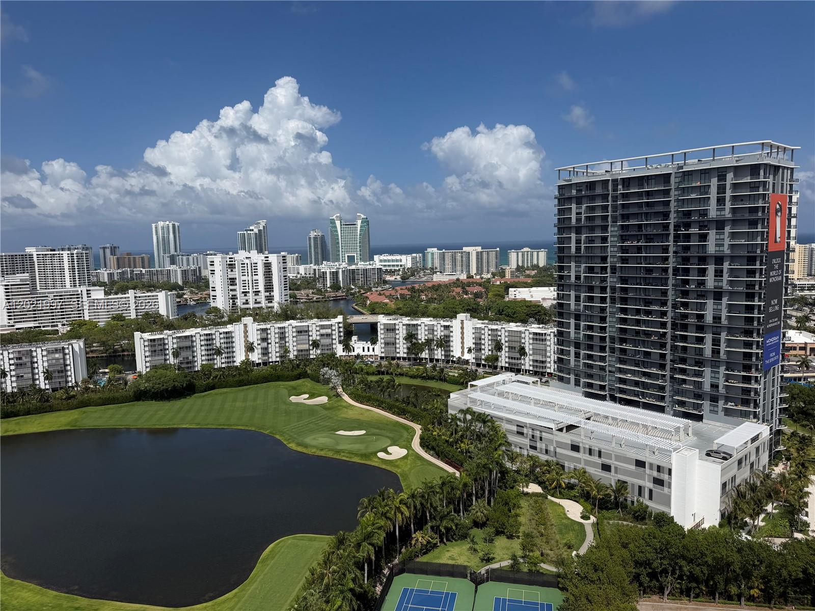 An elevated view shows a golf course, a lake, tennis courts, and several high-rise buildings — 1755 E Hallandale Beach Blvd # 2404E, Hallandale Beach FL 33009, HALLANDALE BEACH, FL
