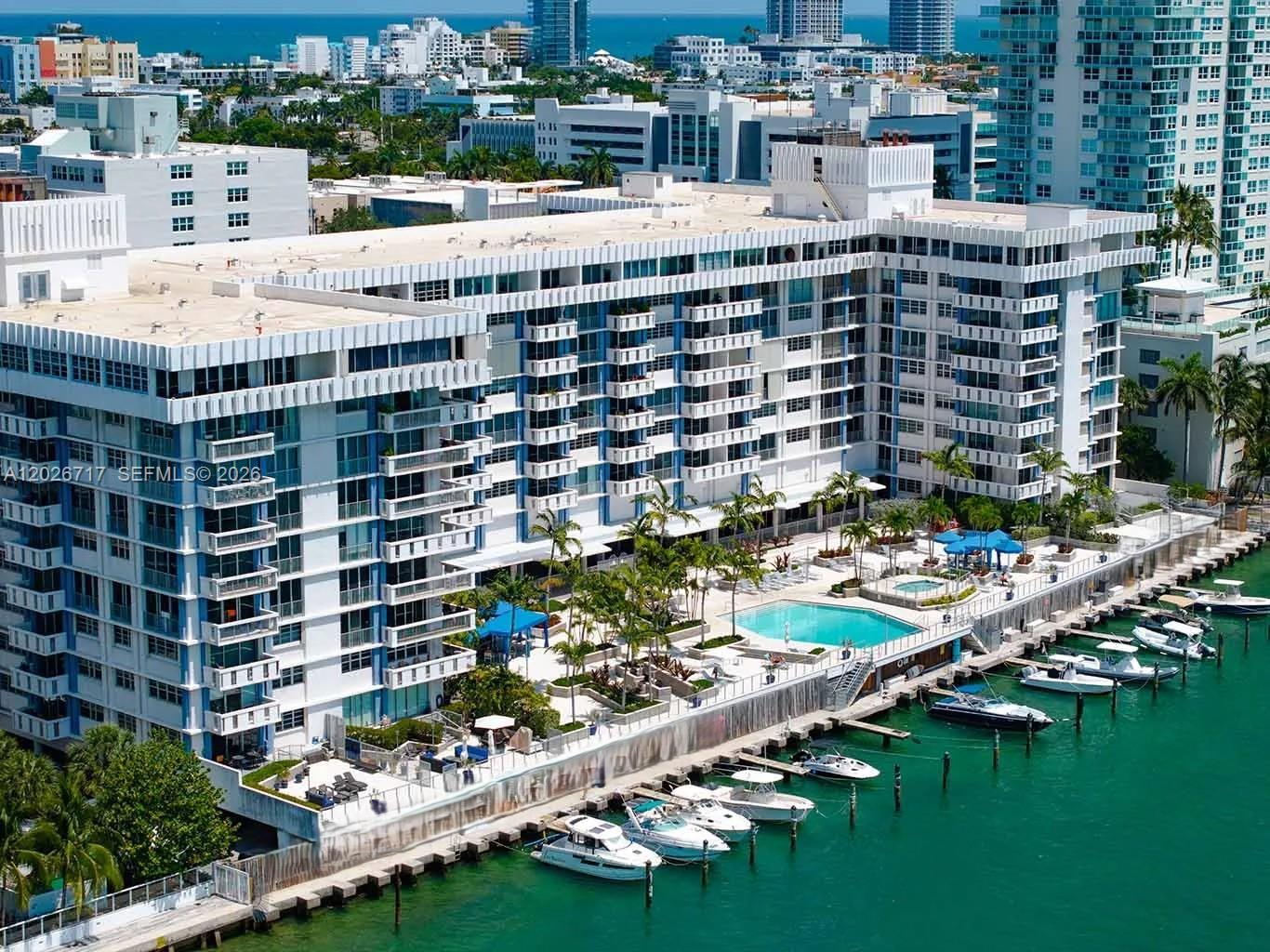 An aerial view of a waterfront apartment building with a pool and private boat slips — 800 West Ave # 342, Miami Beach FL 33139, MIAMI BEACH, FL