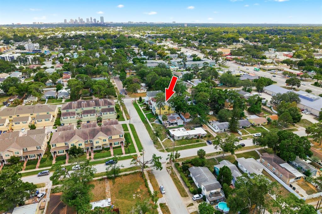 An aerial view shows a residential neighborhood with a red arrow pointing to a house — 4920 3RD STREET N, ST PETERSBURG, FL