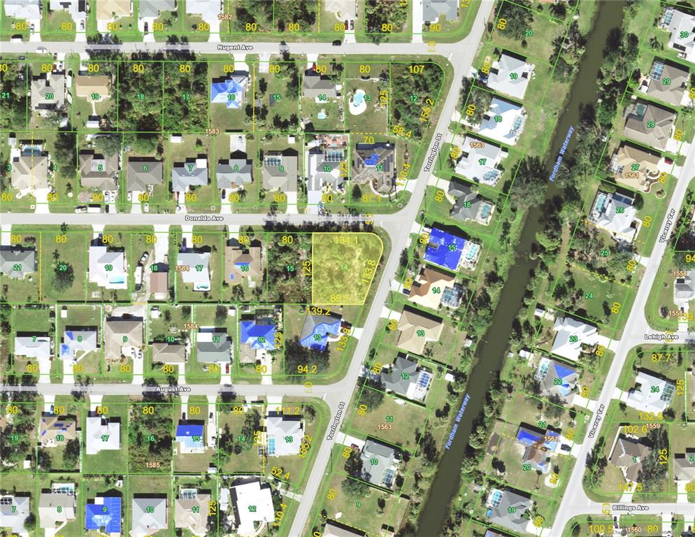 This is an aerial map showing residential lots, streets, and a waterway — 23145 DONALDA AVENUE, PORT CHARLOTTE, FL