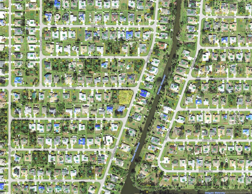 This is an aerial map showing residential lots and streets in a suburban neighborhood — 23145 DONALDA AVENUE, PORT CHARLOTTE, FL