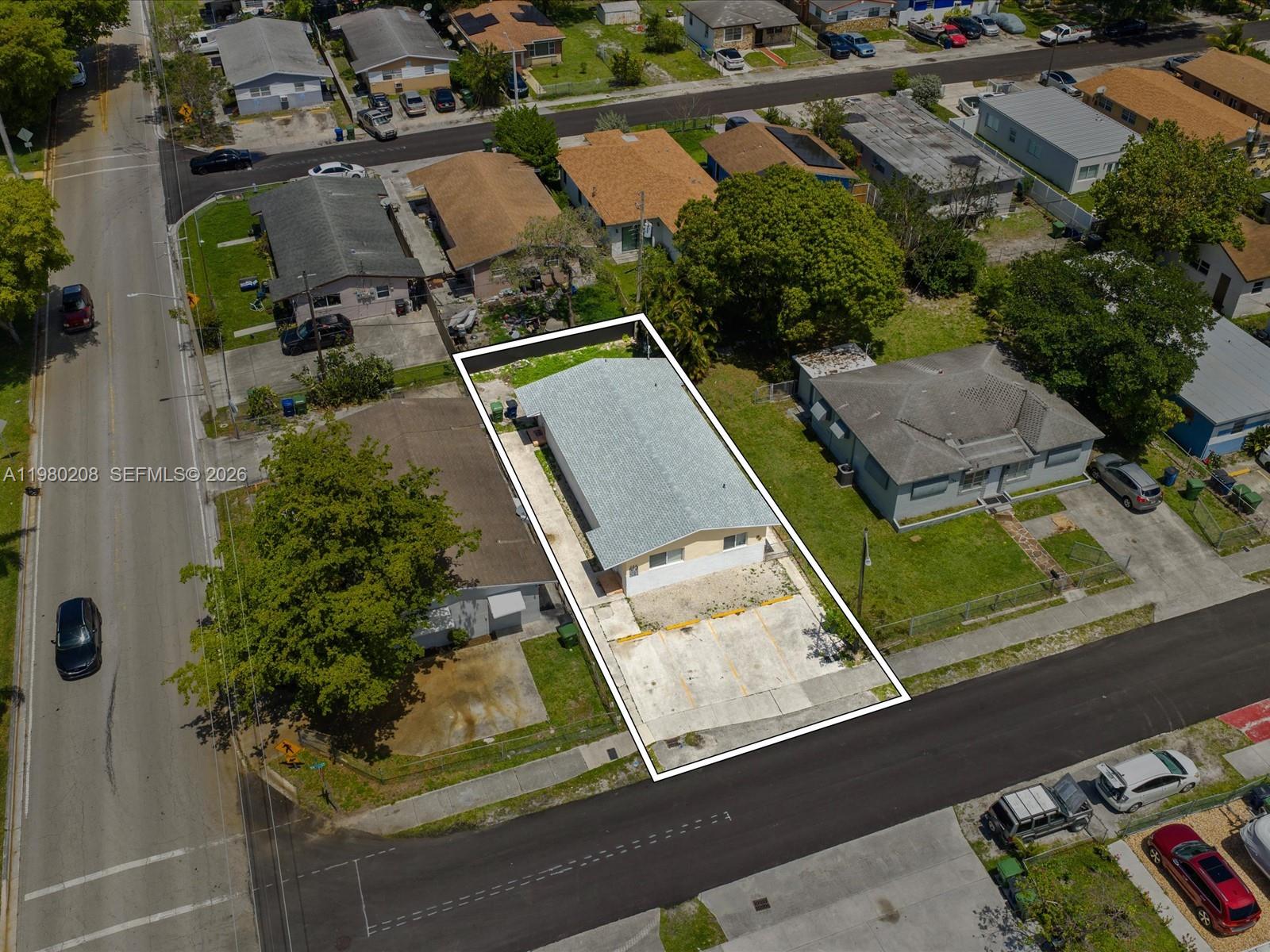 An aerial view shows a rectangular residential lot with a house and paved parking spaces — 752 NW 3rd Ct, Hallandale Beach FL 33009, HALLANDALE BEACH, FL