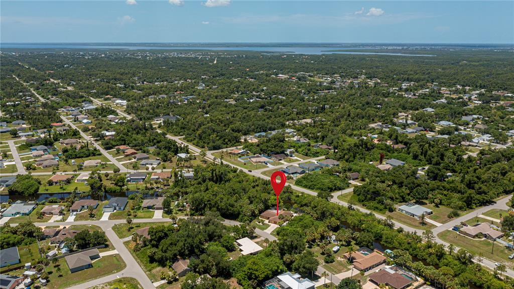 An aerial view shows a residential neighborhood with a red location pin over a house — 2199 BENDWAY DRIVE, PORT CHARLOTTE, FL