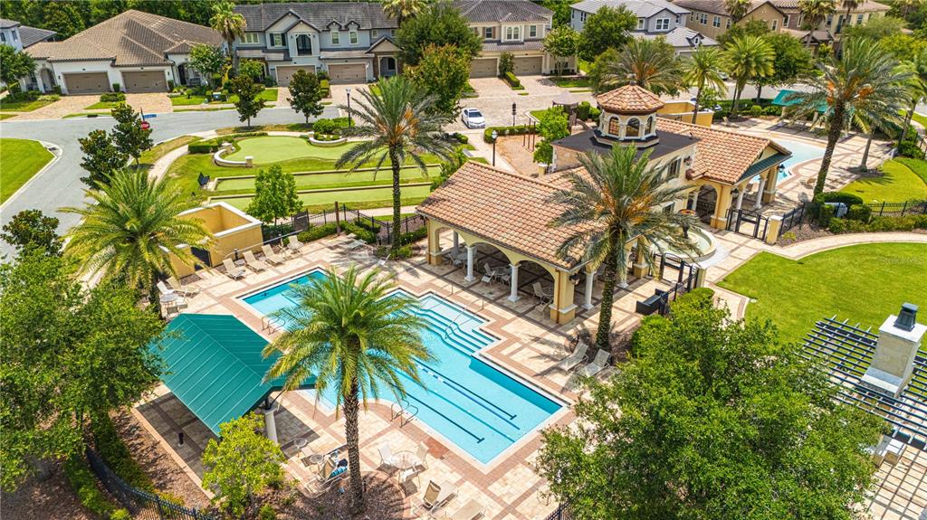 An aerial view of a community swimming pool, clubhouse, and putting green — 3169 PARADOR WAY, JACKSONVILLE, FL