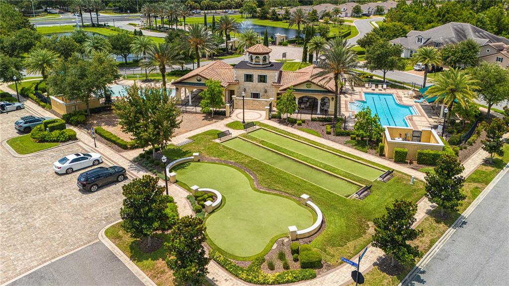 An aerial view shows a community clubhouse with a swimming pool, putting green, and bocce court — 3169 PARADOR WAY, JACKSONVILLE, FL
