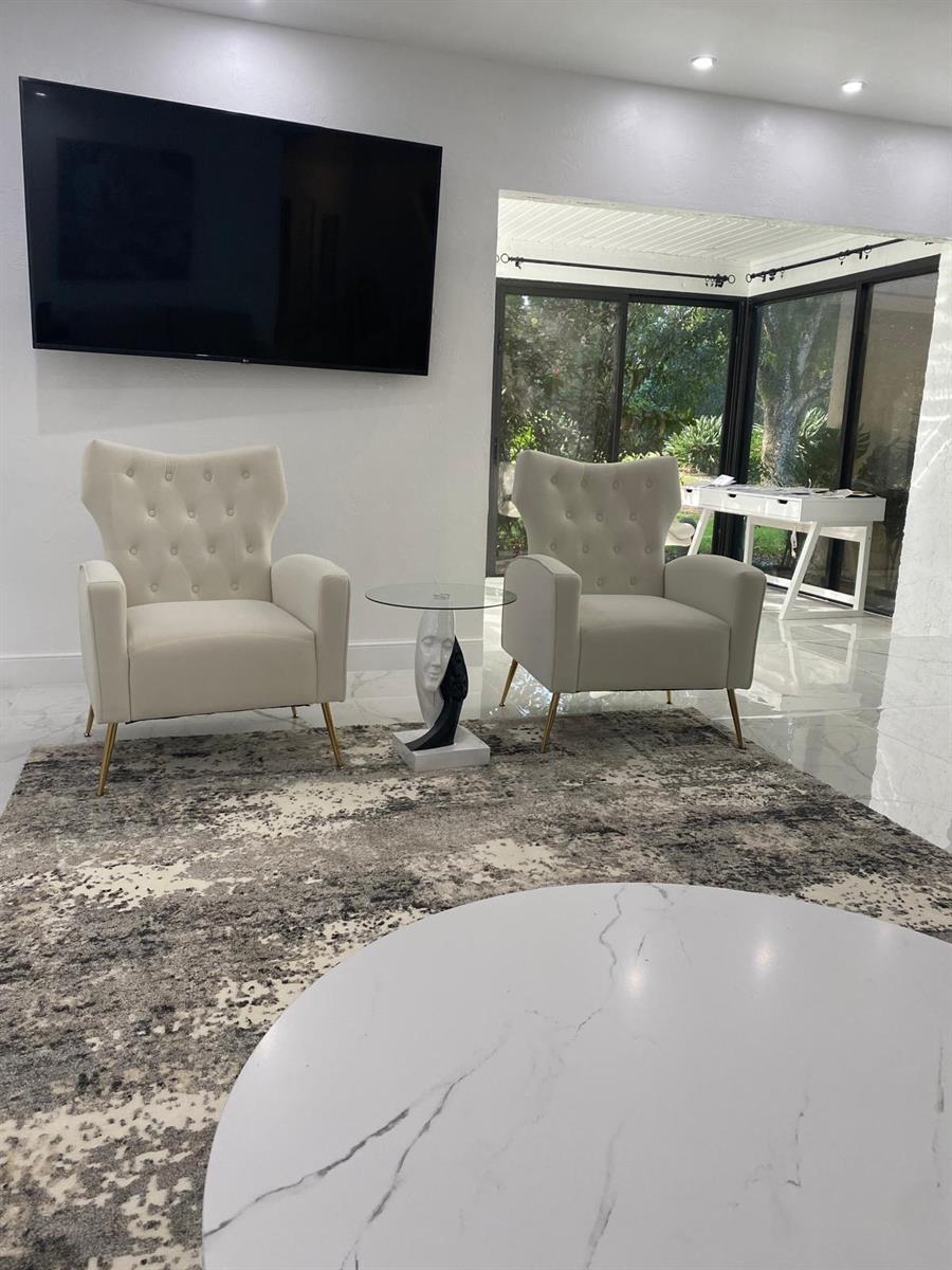 A living room features two tufted armchairs, a glass side table, and a marble coffee table — 21866 Cypress Circle # 31c, Boca Raton FL 33433, BOCA RATON, FL
