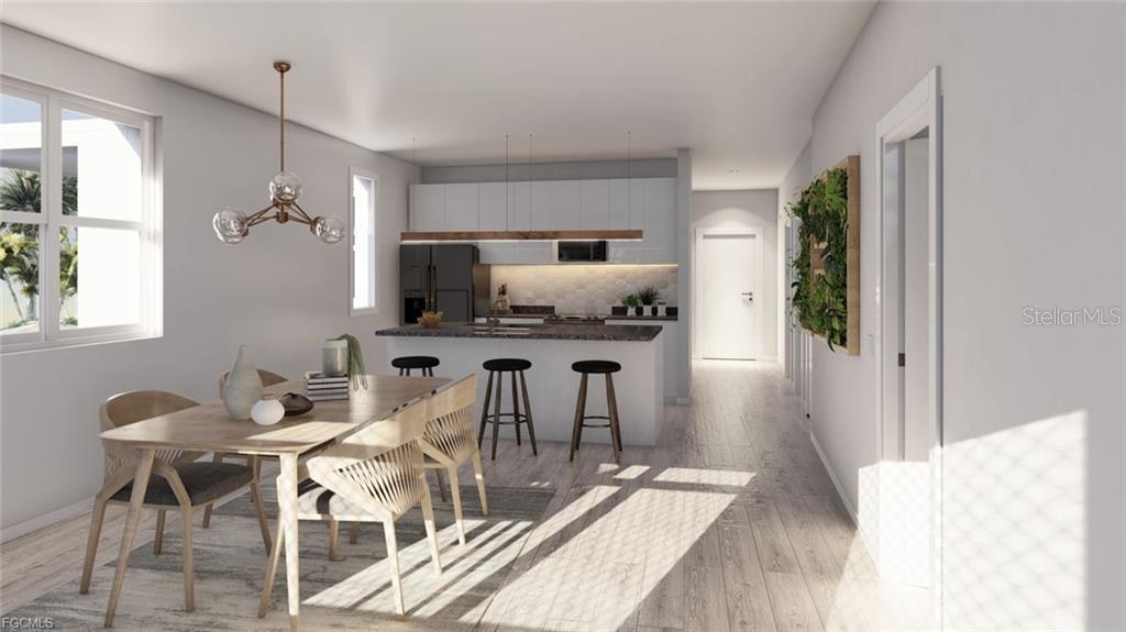 This rendering shows an open-concept kitchen and dining area with modern finishes and wood flooring — 1249 CAPRICORN BOULEVARD, PUNTA GORDA, FL