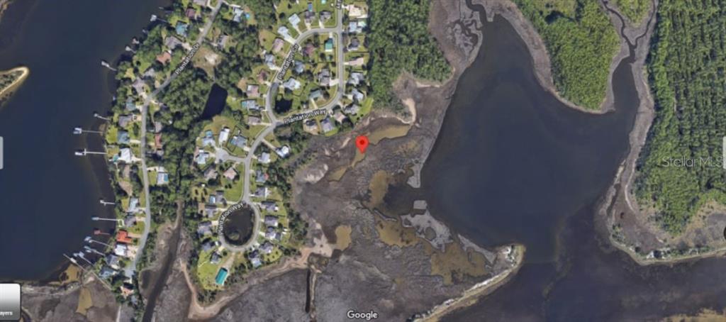 This is a satellite map view showing a residential neighborhood adjacent to a coastal marsh — PLANTATION CIRCLE, PANAMA CITY, FL