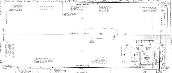 This is a land survey map showing a property boundary, building footprint, and parking lot — N VOLUSIA AVENUE, ORANGE CITY, FL