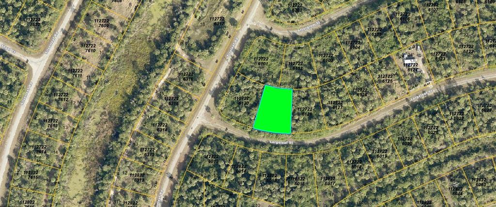 This is an aerial map showing a highlighted vacant lot in a wooded residential area — LARGELEAF STREET, NORTH PORT, FL