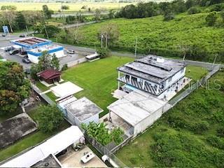 An aerial view shows a multi-story house with a flat roof, a detached garage, and a yard — 927 ANTON RUIZ UNIT KM 27.7, HUMACAO, PR
