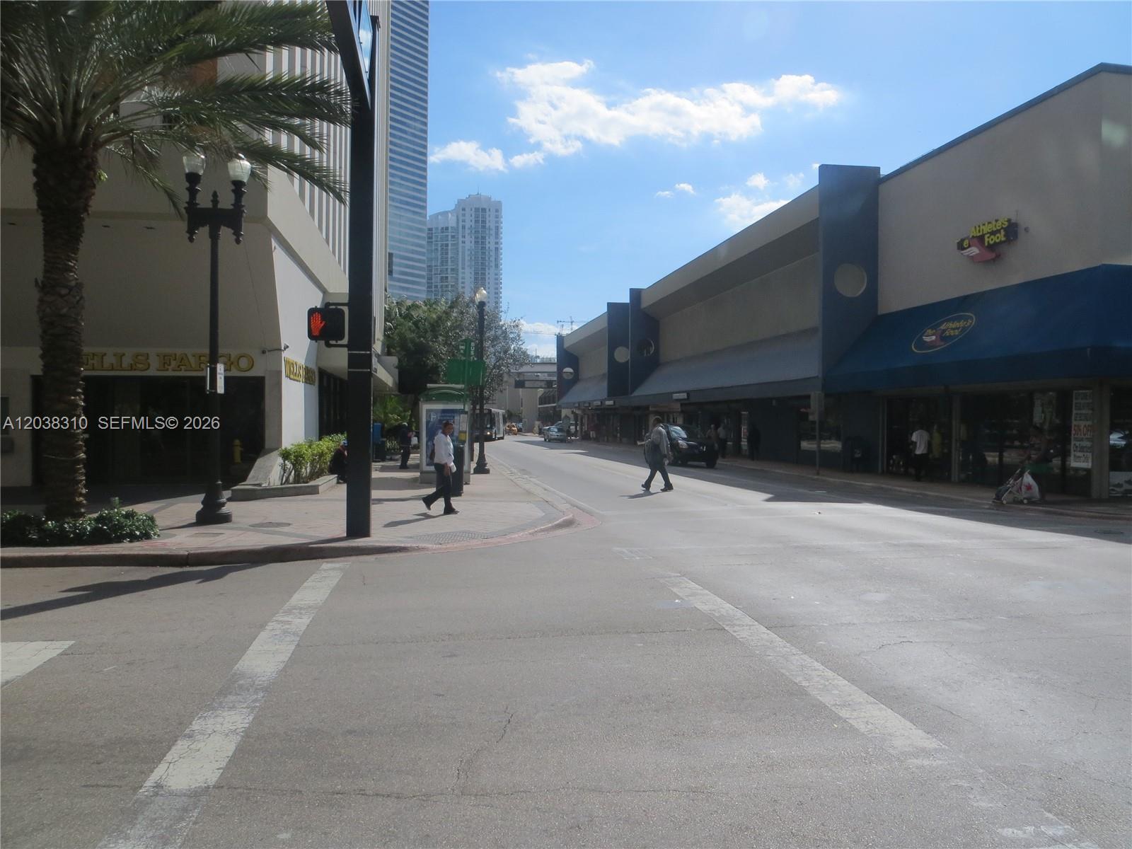 A street view shows a city intersection with a Wells Fargo bank and retail stores — 111 E Flagler St # 503, Miami FL 33131, MIAMI, FL